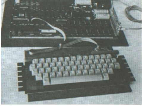 'Got the keyboard? Good one! I'm going to buy a lot and we will get them cheaper. The little board, oh yes, that's the cassette interface, only two chips, Woz invented it, runs at 1,200 baud. Great, you'll love it. The software is the Game of Life.'